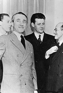 Opening at the exhibition 'Masters of Abstract Art', in Helena Rubinstein's new art center, New York, April 1, 1942 Photograph by L. Model. From left to right: Harry Holtzman, Hans Richter, Burgoyne Diller, Piet Mondrian